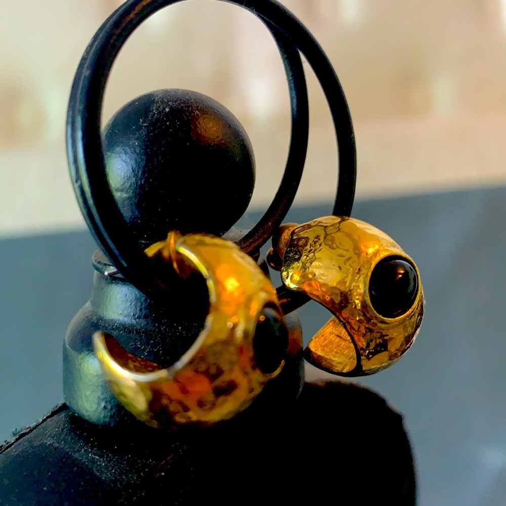 Black studded golden earrings